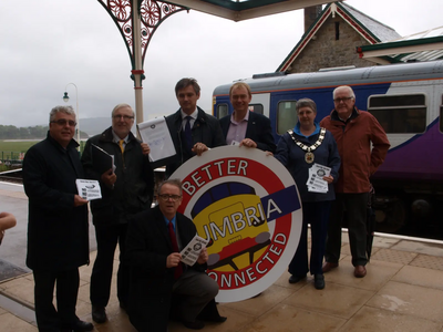 From left to right, Ian Stephens (Cumbria Tourism, Chief Executive), Cllr Peter Thornton (Leader, SLDC), John Woodcock MP, Tim Farron MP, Cllr Liz Lewis (Mayor of Grange) & at the front Cllr Frank Cassidy (Barrow councillor)