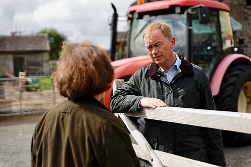 Tim speaking to a local farmer