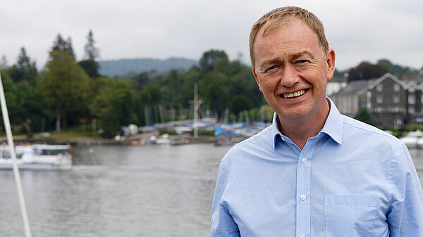 Tim Farron stood at Windermere