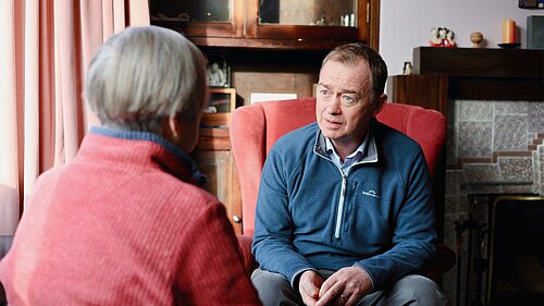 Tim listening to a resident