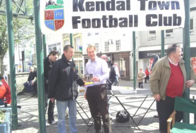 Image courtesy of Kendal Town Football Club Kendal Town FC's Graham O'Callaghan, Tom Roe and Steve Dixon with Tim Farron MP